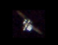 iss (international space station) as it would be seen through a telescope